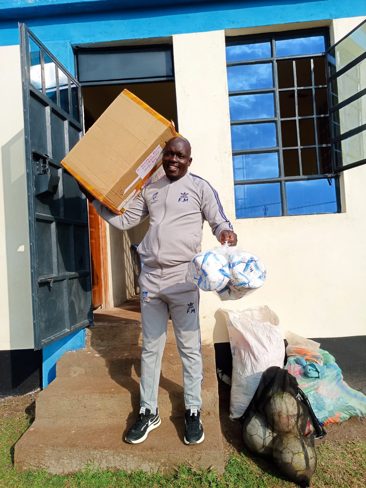 Director receives soccer equipment