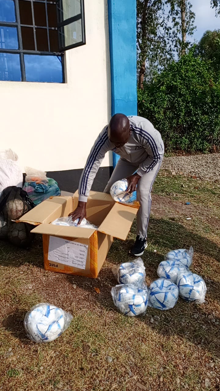 Director receives soccer balls